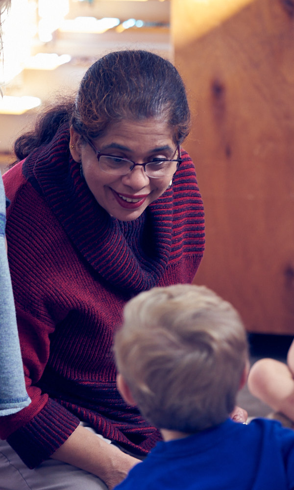 A teacher interacts with children